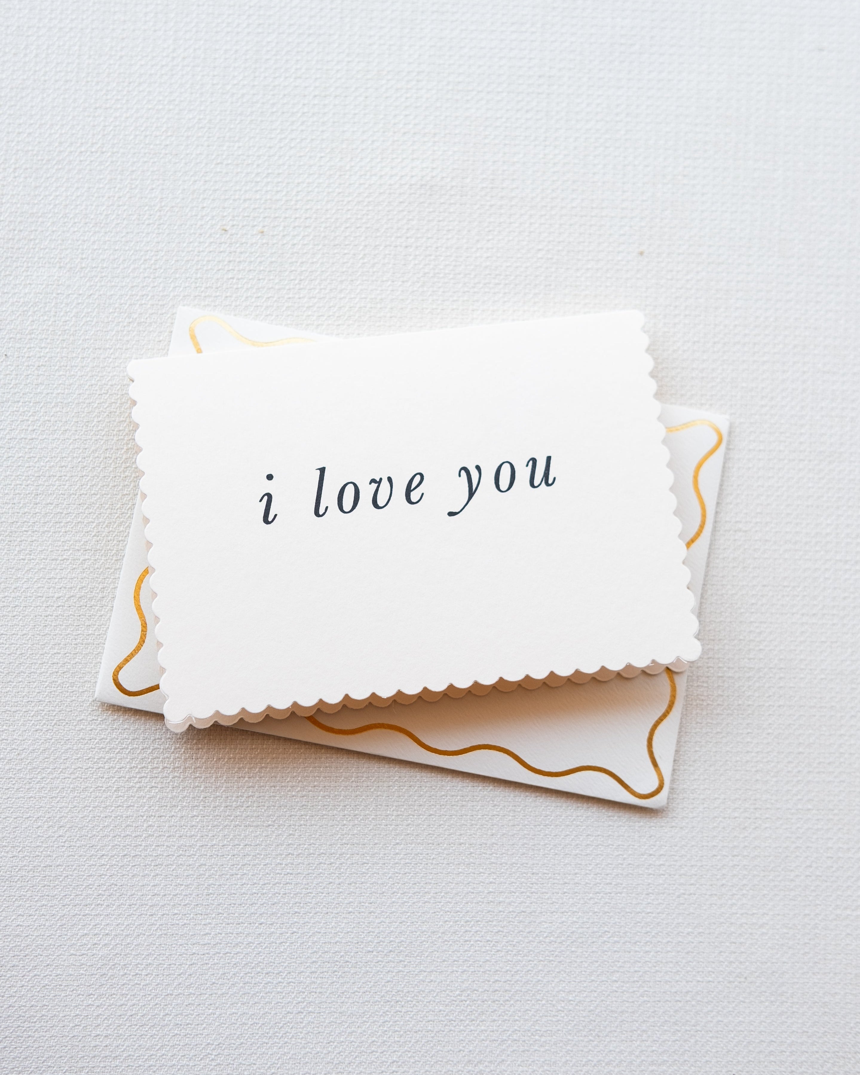 Card with 'i love you' text on a white background