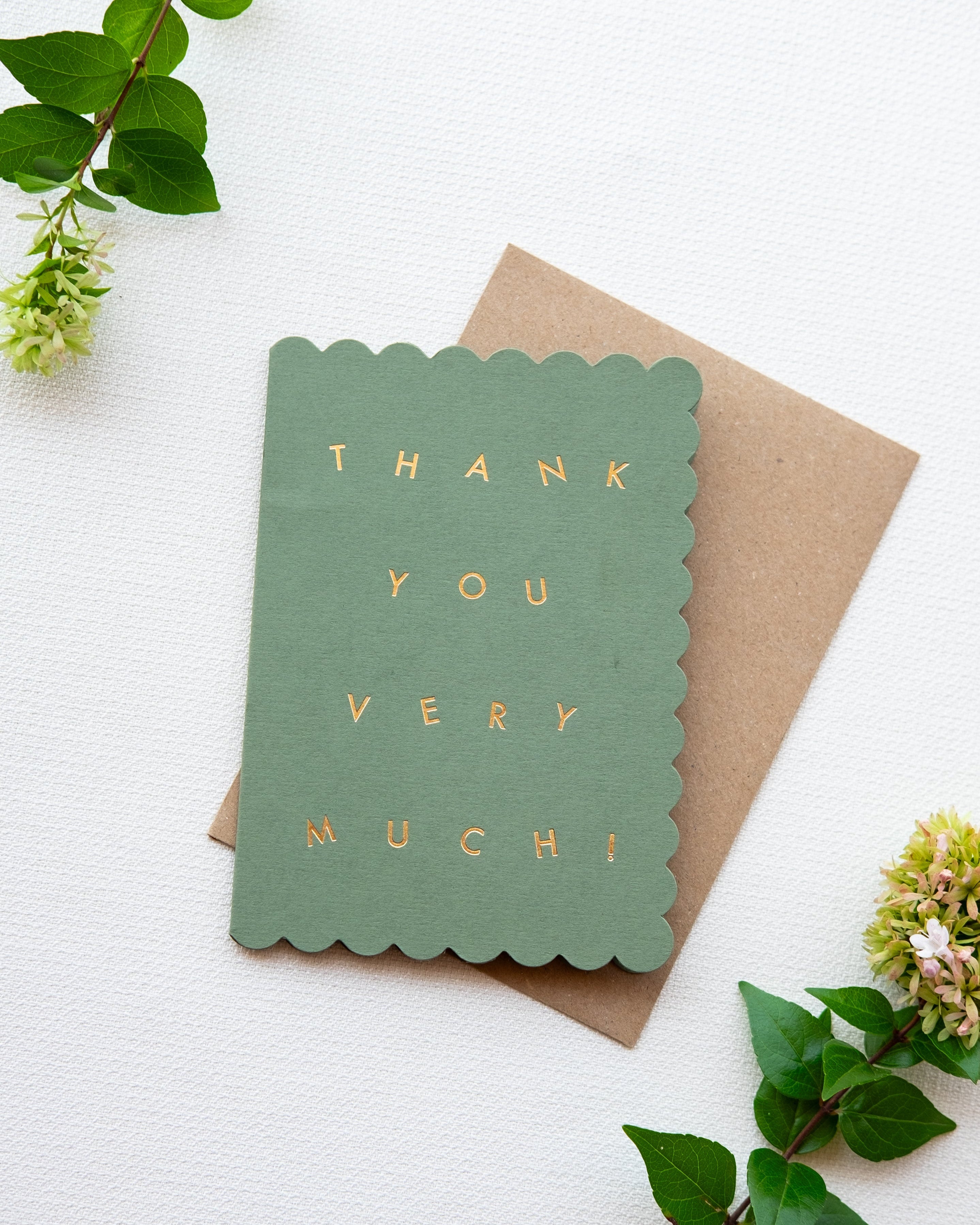 Green card with 'Thank you very much!' text on a white background with greenery.